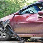 damaged red car