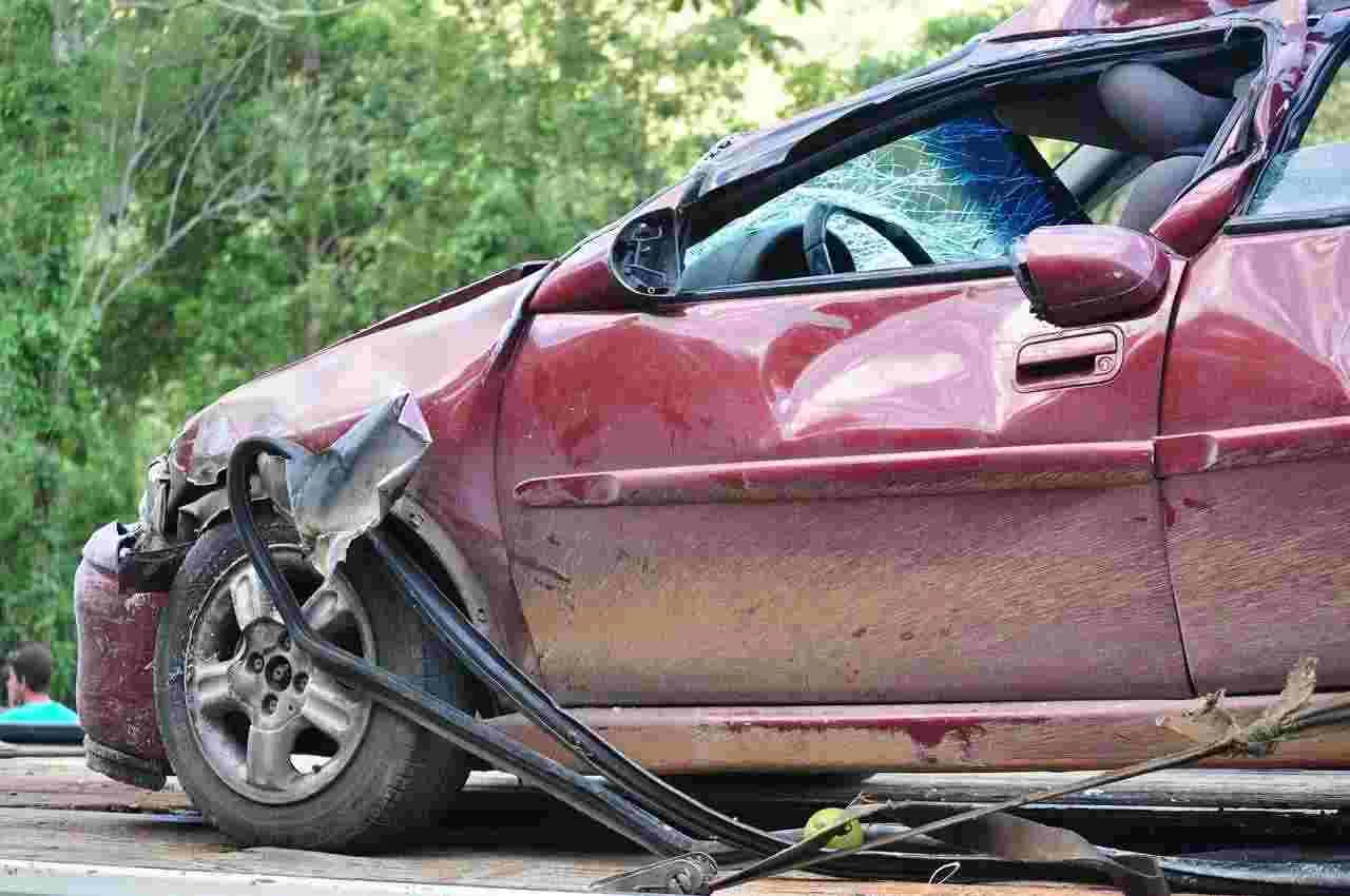 damaged red car