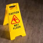Yellow Wet Floor Sign. Caution wet floor and slippery surface sign