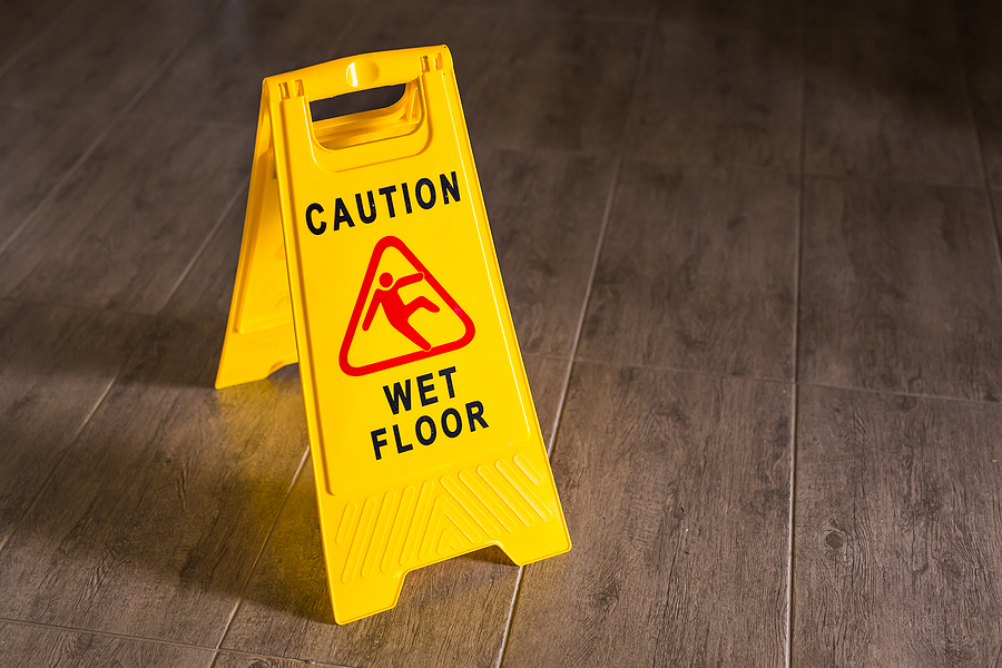 Yellow Wet Floor Sign. Caution wet floor and slippery surface sign